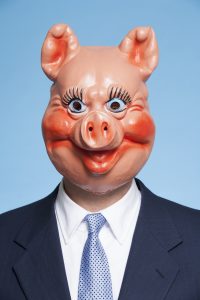 Businessman with pig mask